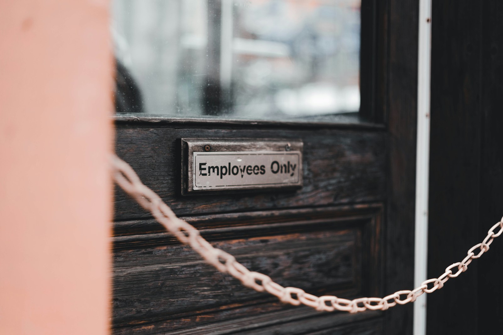a close up of a door with a chain on it